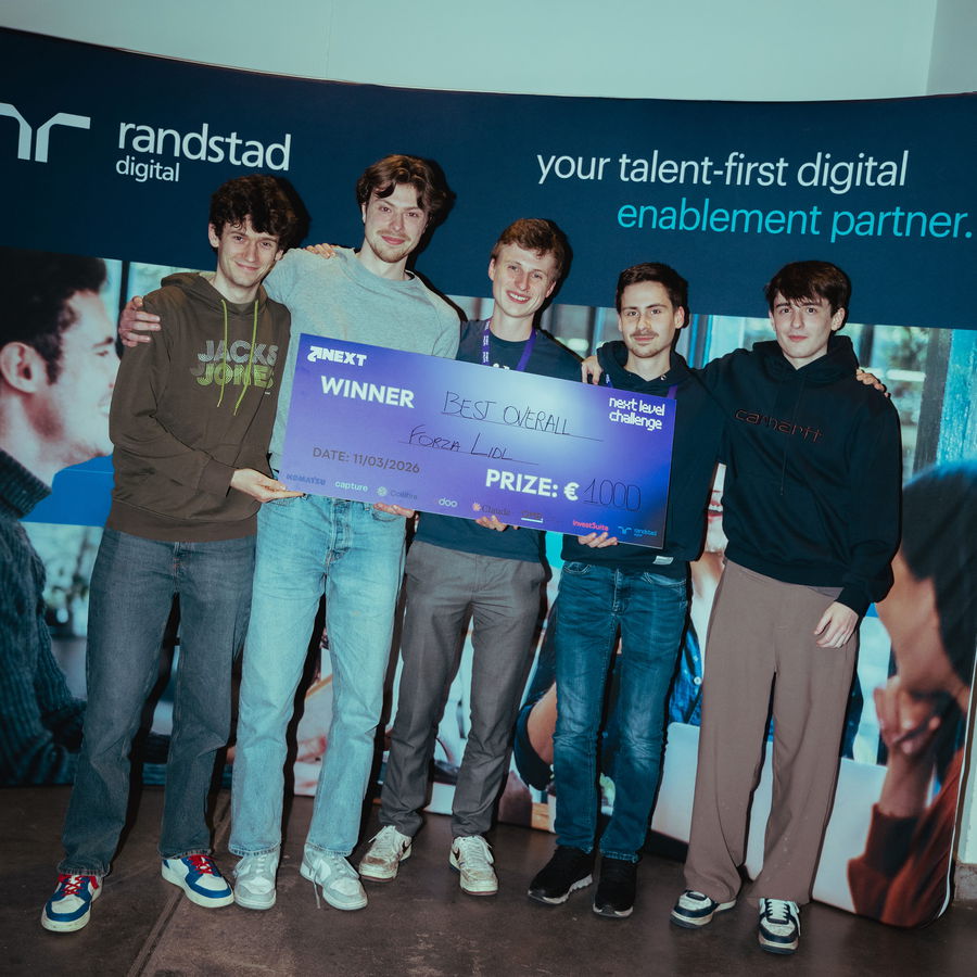 A winning team holding their oversized prize cheque