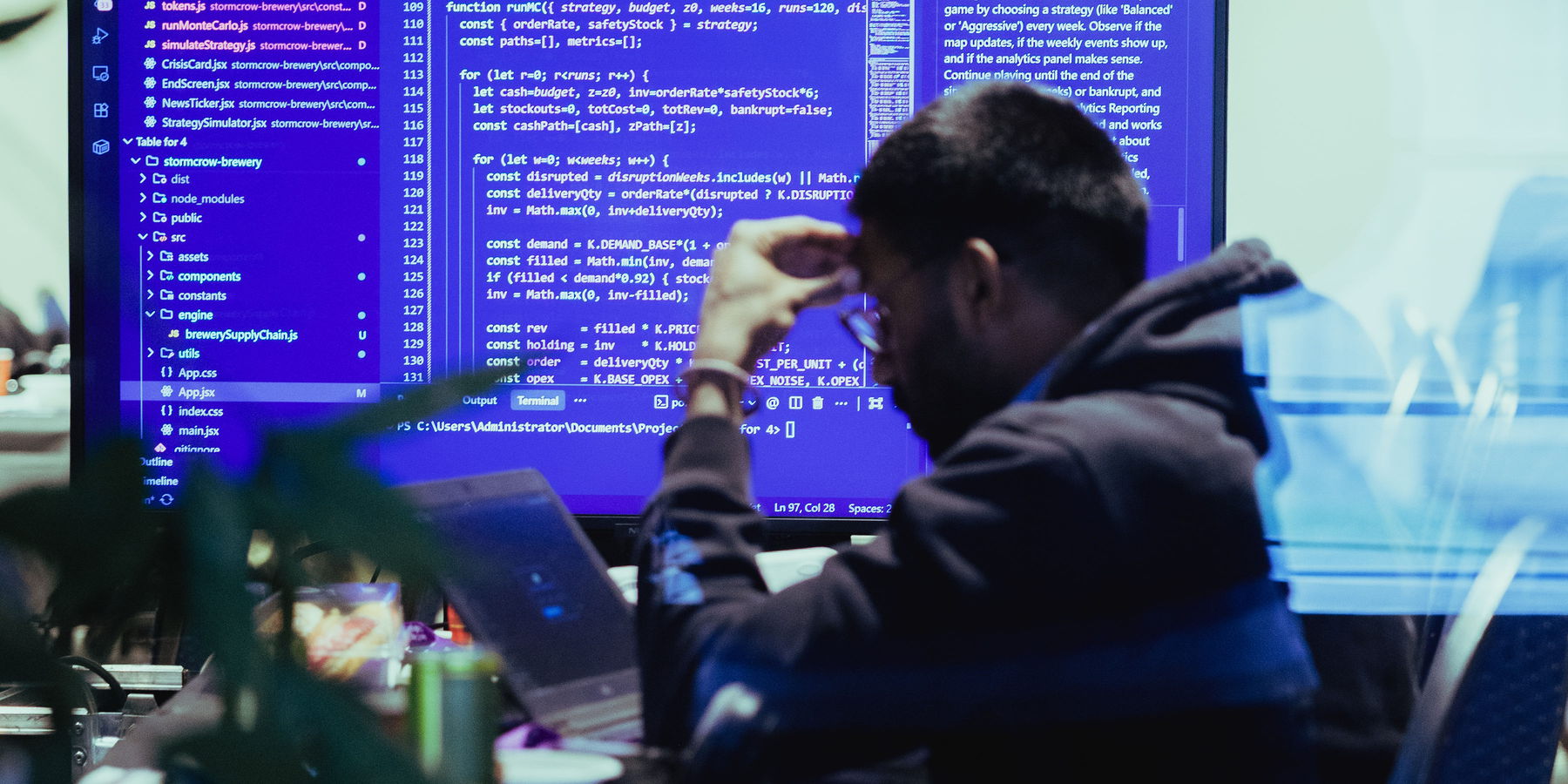 A participant writing the simulation engine behind their prototype