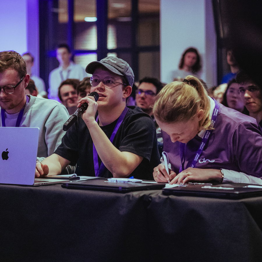 A team working together at their table during the evening session