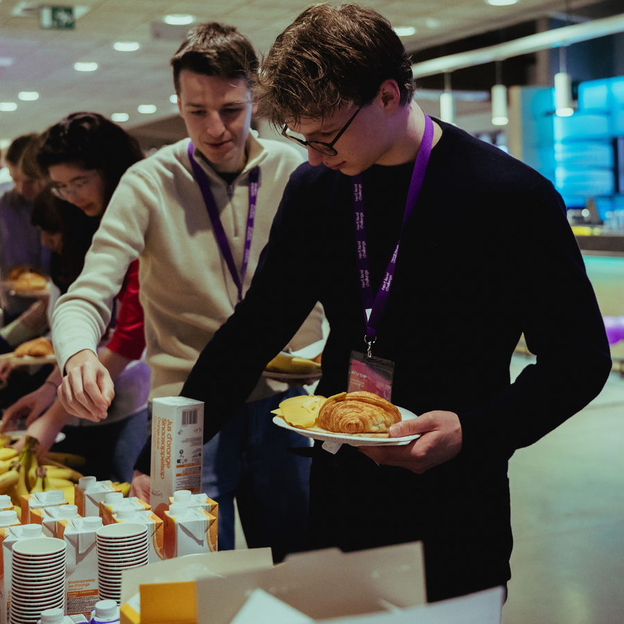 Participants helping themselves at the breakfast table